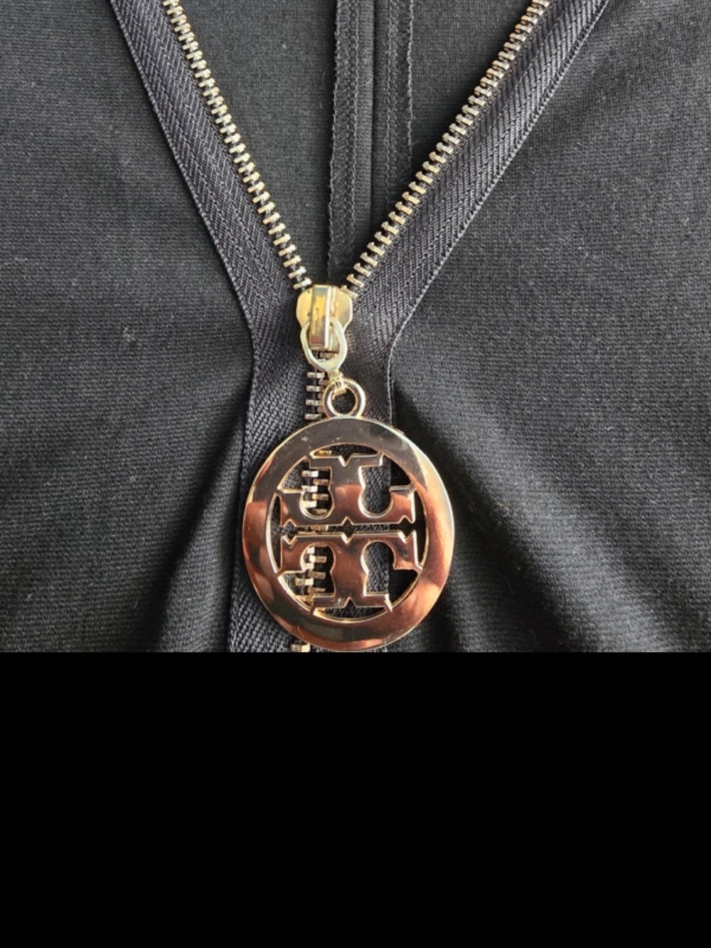 Tory Burch women’s  Black Zip-Front Accessory with Gold Logo Pull